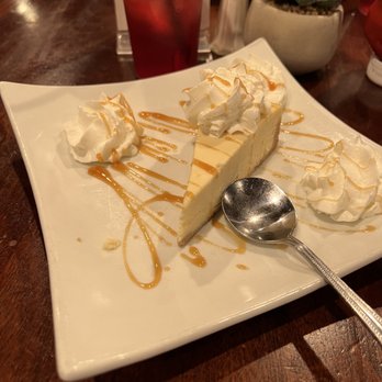 54 Main Bar and Grille - Cheesecake with unsweetened iced tea in the background. - Sports Bars Near Me - Madison, New Jersey 54 Main Bar and Grille - Cheesecake with unsweetened iced tea in the background. - Sports Bars Near Me - Madison, New Jersey