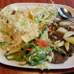 Waaberi - Rice with cardamom and raisins / sliced beef steaks. This plate was as big as a tray.
