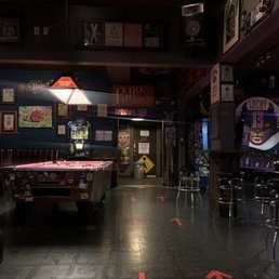 a pool table in the middle of the room a pool table in the middle of the room