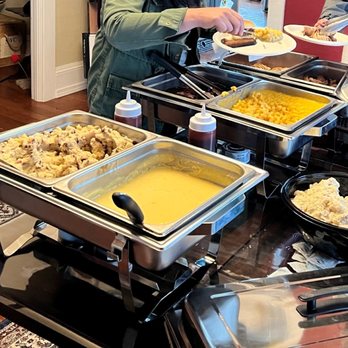 J & L BBQ - a man serving food at a buffet - American Near Me - Everett, Washington J & L BBQ - a man serving food at a buffet - American Near Me - Everett, Washington