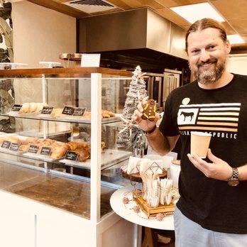 Kauai Bakery - My super excited boyfriend on Christmas Eve holding a cortado and gingerbread cookie! - Bakeries Near Me - Lihue, Hawaii