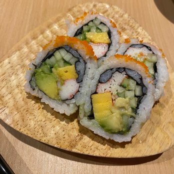 Fisshu - three pieces of sushi on a wooden plate - Asian Fusion Near Me - Montreal, Quebec Fisshu - three pieces of sushi on a wooden plate - Asian Fusion Near Me - Montreal, Quebec