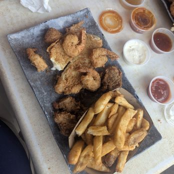 Bahama Bobs - Fried seafood platter, come with fried fish, shrimp and oysters with fries. Fried oysters were amazing and the fish tasted great. - Seafood Near Me - Gulf Shores, Alabama