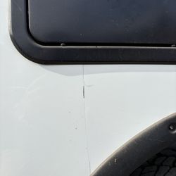 RV Masters - Body work failed and crack emerged shortly after repair Notice how they never bothered to caulk the wheel well.