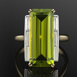 4.4ct Peridot with diamond accents set in 14ky.
