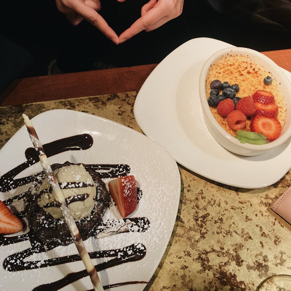 two plates of desserts on a table two plates of desserts on a table