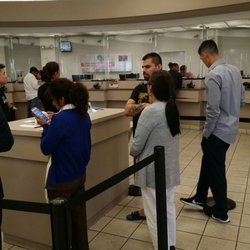 Bank of America Financial Center - 20+ customers waiting with1 teller and 15+ merchants for the other teller, what the $/&*#