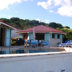 Los Bohios - View from the deck of the hot tub to 2 of the bohios and the pool