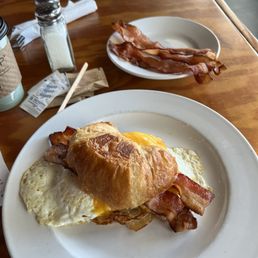 Bacon, Egg & Cheddar Breakfast Sandwich with a side of bacon Bacon, Egg & Cheddar Breakfast Sandwich with a side of bacon