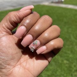 Allure Nail Bar - This is my go to nail color and I switch up the gems between flowers or cherries; I've also had a bow and 3D flower done.