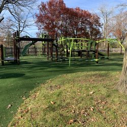 Danny Cunniff Park - Older playground area with fence surrounding.