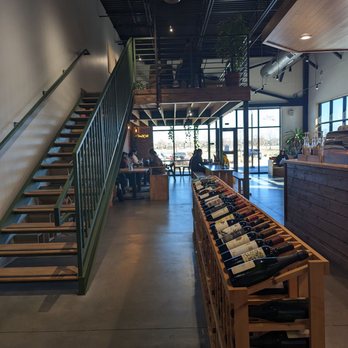 Chill Coffee and Wine Bar - Wine rack, looking up toward the upstairs sitting area. - Coffee & Tea Near Me - Arlington, Texas