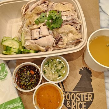 Rooster & Rice - The Original with thigh meat upcharge ($14.95 + $1). Plus another upcharge ($1.45) for KMG sauce. This was pricey....12/13/2023 - Thai Near Me - Irvine, California