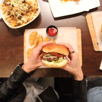 Showtime Bistro - Juicy juicy burger! Oh my gosh, the fries there are amazing, forgot to mention that. The wedges that come with the burgers are perfect! - Burgers Near Me - Toronto, Ontario