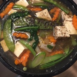 a pan of soup with tofu and vegetables a pan of soup with tofu and vegetables