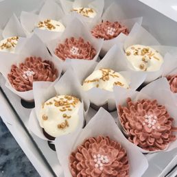 Red velvet cupcakes with cream cheese and buttercream frosting