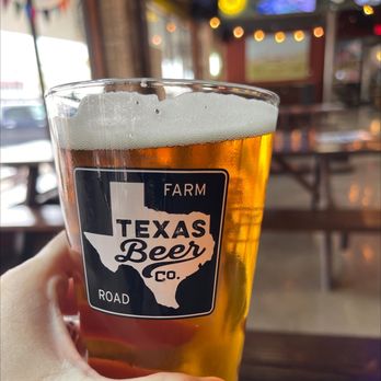 2.0 Brewing Company - a hand holding a pint of beer - Breweries Near Me - Taylor, Texas 2.0 Brewing Company - a hand holding a pint of beer - Breweries Near Me - Taylor, Texas