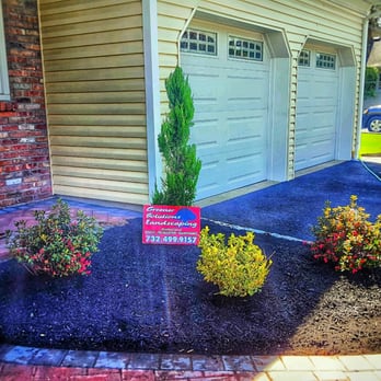 Greener Solutions Landscaping - a front yard with shrubs and a sign - Snow Removal Near Me Greener Solutions Landscaping - a front yard with shrubs and a sign - Snow Removal Near Me