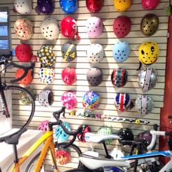Sport Star Bikes - Wall of candy colored helmets!