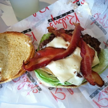 Ruby's Diner - The menu says this burger is supposed to be "Piled High" with bacon? Skimpy Bacon, small dry patty, dry bun, and lots of lettuce - Diners Near Me - Tustin, California Ruby's Diner - The menu says this burger is supposed to be "Piled High" with bacon? Skimpy Bacon, small dry patty, dry bun, and lots of lettuce - Diners Near Me - Tustin, California