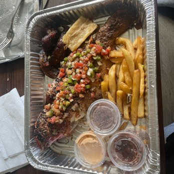 Spicy Water African Grill - Leftovers from a Grilled Red Snapper Plate. The full order was double the amount of food in this photo. - African Near Me - Washington, DC, District of Columbia Spicy Water African Grill - Leftovers from a Grilled Red Snapper Plate. The full order was double the amount of food in this photo. - African Near Me - Washington, DC, District of Columbia