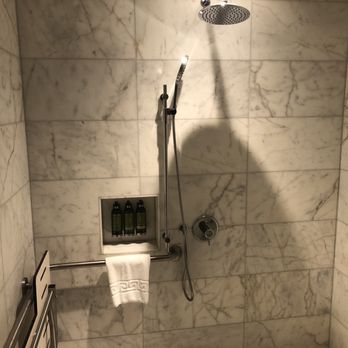 Seaside Hotel - Nice roll-in shower with bench option for easy wheelchair transfer. Reachable controls with rain and handheld shower head options. - Hotels Near Me - North Vancouver, British Columbia Seaside Hotel - Nice roll-in shower with bench option for easy wheelchair transfer. Reachable controls with rain and handheld shower head options. - Hotels Near Me - North Vancouver, British Columbia