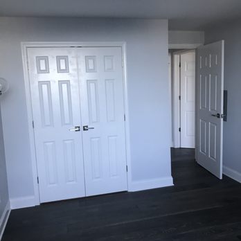 Norpro Services Ltd - a hallway with white doors - General Contractors Near Me
