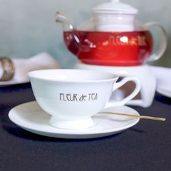 Fleur de Thé - Fleur de Thé teacup and saucer with a pot of tea