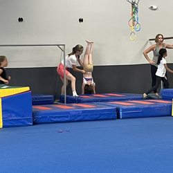 Jumparama Gymnastics - My daughter is in the back doing handstand on the wall.