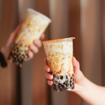 CoCo - two people holding cups of bubble tea - Bubble Tea Near Me - Oshawa, Ontario CoCo - two people holding cups of bubble tea - Bubble Tea Near Me - Oshawa, Ontario