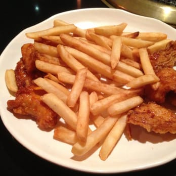 Bonchon Cambridge - John F Kennedy St - 8-piece chicken strips...the fries are covering most of it - Korean Near Me - Cambridge, Massachusetts