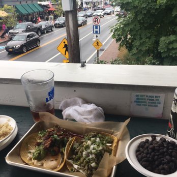 Treehouse Taqueria - View from outdoor seating. Two tacos plus rice and beans served in very cheap toss out containers that leaked. - Tacos Near Me - Ogunquit, Maine Treehouse Taqueria - View from outdoor seating. Two tacos plus rice and beans served in very cheap toss out containers that leaked. - Tacos Near Me - Ogunquit, Maine