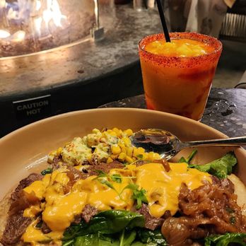 Centrico - Huarache de Asada with a scoop of Mexican Street Corn and a Frozen Mango Margarita. - Mexican Near Me - Anaheim, California