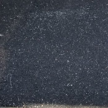 Cobblestone Auto Spa - Close up dirt in the trunk - Auto Detailing Near Me - Tempe, Arizona