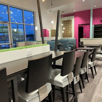 Salata - a row of chairs in a restaurant - Salad Near Me - Euless, Texas