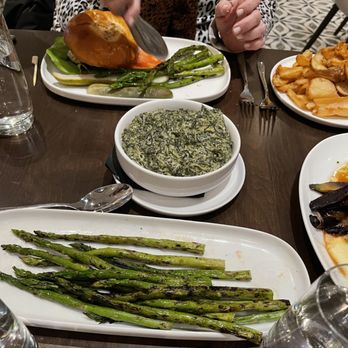 The Union - Chicken burger, asparagus (left on plate after some was grabbed off) & creamed spinach sides - Sushi Bars Near Me - East Meadow, New York The Union - Chicken burger, asparagus (left on plate after some was grabbed off) & creamed spinach sides - Sushi Bars Near Me - East Meadow, New York