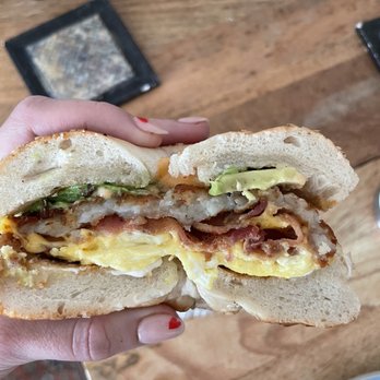 Lite Bites - Bacon, egg, cheese, hash brown, avocado on a sesame bagel - Delis Near Me - Brooklyn, New York
