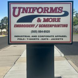 Uniforms & More sign in front of building. Embroidery and Screenprinting