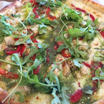 Blaze Pizza - Green stripe pizza no sauce, pesto drizzled over chicken, red peppers, garlic, mozzarella, arugula - Salad Near Me - Carmel, Indiana