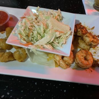 Johnny Huston's - Photo of grilled shrimp, coleslaw, and Tater tots. Sorry I took it after eating some! - Seafood Near Me - Navarre, Florida Johnny Huston's - Photo of grilled shrimp, coleslaw, and Tater tots. Sorry I took it after eating some! - Seafood Near Me - Navarre, Florida