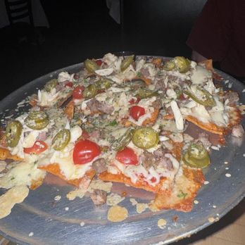 Terilli's Restaurant & Bar - Cheese Italchos comes with any custom topping you want - Italian Near Me - Dallas, Texas Terilli's Restaurant & Bar - Cheese Italchos comes with any custom topping you want - Italian Near Me - Dallas, Texas