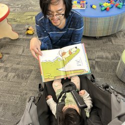 LA County Library - Temple City Library - Uncle Dante reading to baby