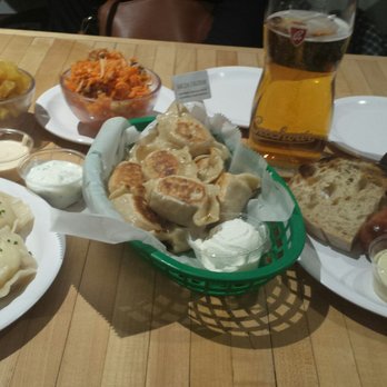 Baba's Pierogies - A family-style feast:  Hone in on the plump, boiled Potato & Cheese Pierogies (L), & the Kielbasy (R).  Our favorite dishes of the meal. - Modern European Near Me - Brooklyn, New York