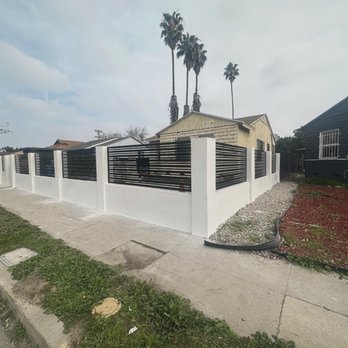 Pristine Builders - a house with a fence in front of it - Masonry/Concrete Near Me Pristine Builders - a house with a fence in front of it - Masonry/Concrete Near Me