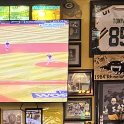 Sports bar with many TVs and lots of Green Bay Packers stuff on the walls. Cool place.