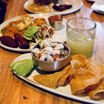 Ceviche's - Corvina Ceviche, small (front picture) & Arroz Con Pollo (right behind it) - Seafood Near Me - Wilmington, North Carolina