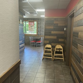 Arby's - a hallway with chairs and tables - Fast Food Near Me - Albion, Michigan