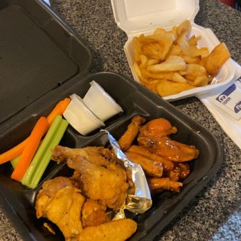 VooDoo Wing - a tray of chicken wings, carrots, celery, and fries - Chicken Wings Near Me - Tuscaloosa, Alabama
