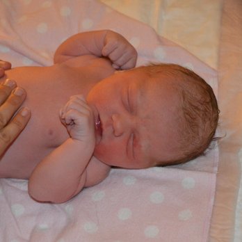 Beautiful Beginnings Homebirth - Photo of midwife's hands examining newborn baby - Midwives Near Me Beautiful Beginnings Homebirth - Photo of midwife's hands examining newborn baby - Midwives Near Me