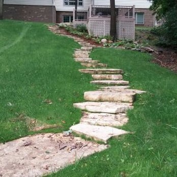 Quality Outdoor Services - Natural step installation to ease traversing this aggresive slope in Ann Arbor. - Landscape Architects or Designers Near Me